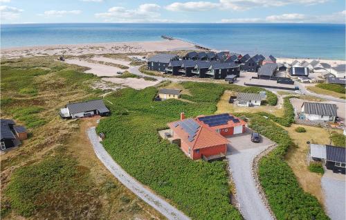 an aerial view of a model house next to the beach at 4 Bedroom Stunning Home In Thisted in Thisted