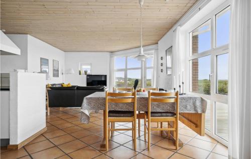 a kitchen and dining room with a table and chairs at 4 Bedroom Stunning Home In Thisted in Thisted