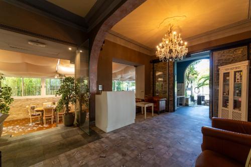 a hallway with a dining room and a chandelier at KAIAN MAITEA in Plentzia