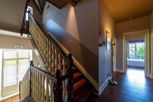 a hallway with a staircase in a home at KAIAN MAITEA in Plentzia