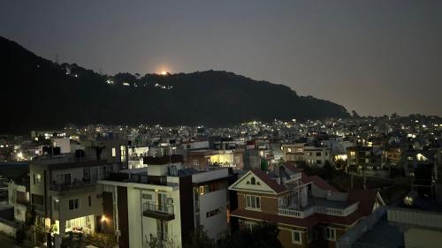 a view of a city at night with buildings at Raniban Suites - Apartment Home in Kathmandu