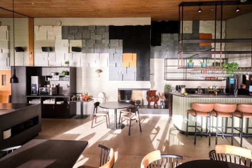 a kitchen with a table and chairs in a room at Sirdalsvatnet Hotel in Sirdal in Tonstad