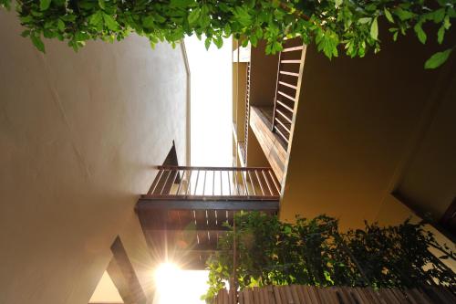 a spiral staircase in a building with a window at Villa Bangkok in Bangkok