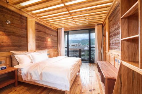 Ένα ή περισσότερα κρεβάτια σε δωμάτιο στο Shaxi Upstay