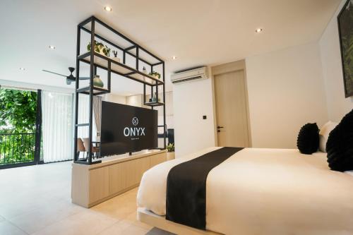 Ένα ή περισσότερα κρεβάτια σε δωμάτιο στο Onyx Beach Hotel