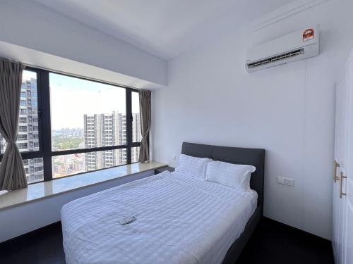 a bedroom with a white bed with a large window at R&F Princess Cove View Residences by WSD in Johor Bahru