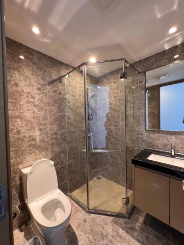 a bathroom with a shower and a toilet and a sink at R&F Princess Cove View Residences by WSD in Johor Bahru