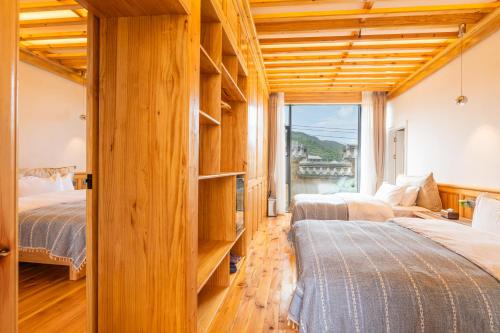 Ένα ή περισσότερα κρεβάτια σε δωμάτιο στο Shaxi Upstay