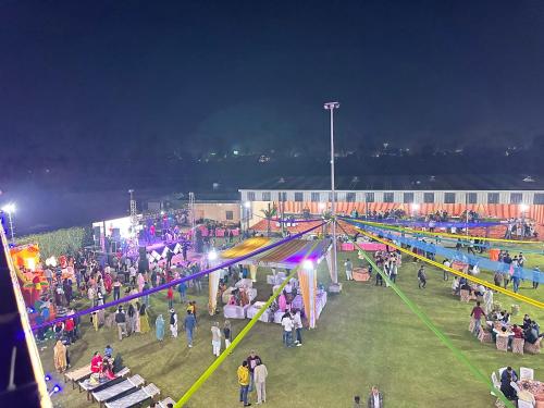 an overhead view of a crowd of people at an event at SS Farms Hotel & Resort in Sonīpat