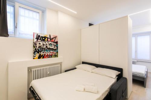 Postel nebo postele na pokoji v ubytování MAMELI HOME - M4 Tricolore