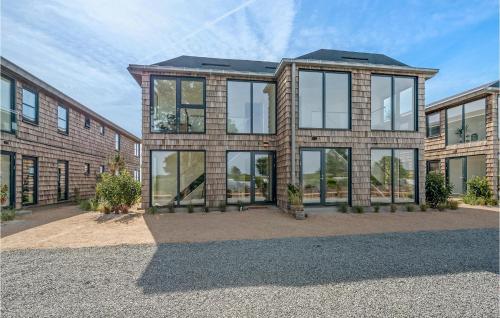 a large brick building with glass windows at Gorgeous Apartment In Kerteminde in Kerteminde