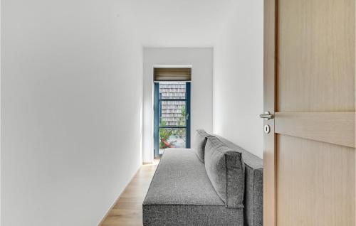 a living room with a couch and a window at Gorgeous Apartment In Kerteminde in Kerteminde