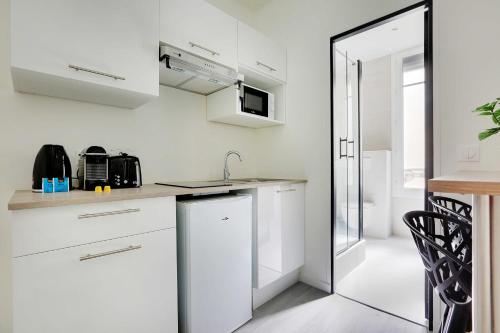 Η κουζίνα ή μικρή κουζίνα στο Charming Apartment -1BR-4P- Château de Vincennes