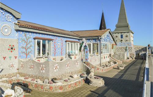a building covered in mosaic tiles with a church at Holiday Home Lemvig 12 in Lemvig