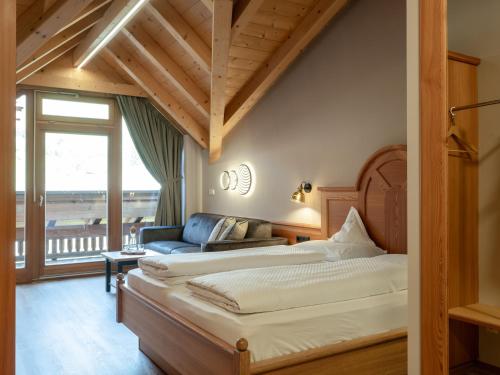 Postel nebo postele na pokoji v ubytování Hotel Bacherhof