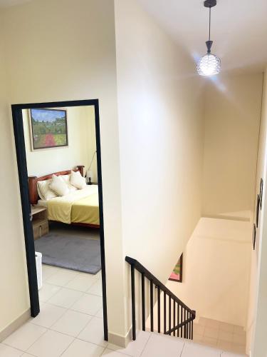a bedroom with a bed and a mirror at Baan Mali Three in Hua Hin