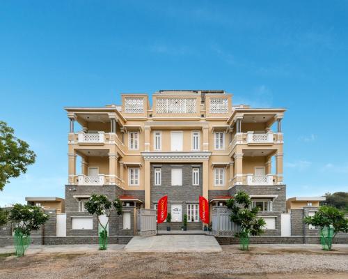 a building with red flags in front of it at The Hills collective with private plunge pool My Downtown Hotel in Udaipur