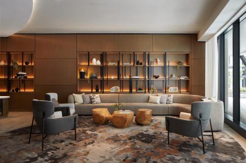 a living room with a couch and chairs at InterContinental Seattle Bellevue, by IHG in Bellevue