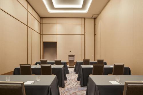 a conference room with tables and chairs and a podium at InterContinental Seattle Bellevue, by IHG in Bellevue