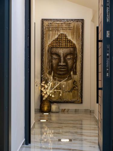 a painting of a head on a wall in a hallway at NOVA LUXURY DESIGN in Zagreb