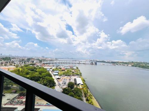 a view of a river from a balcony at R&F Princess Cove View Residences by WSD in Johor Bahru