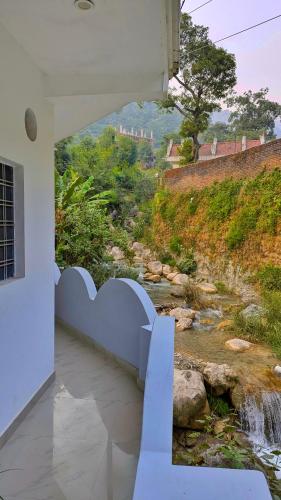 a view of a river from a house at Hobbit House Hostel in Rishīkesh