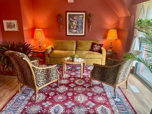 a living room with a couch and two chairs at Big apartment by the Farmers market in Kitchener