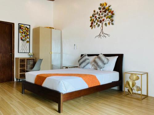 a bedroom with a large bed in a room at Subic Grand Seas Resort in Olongapo