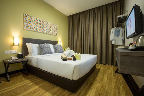 Humaira Hotel tesisinde bir odada yatak veya yataklar