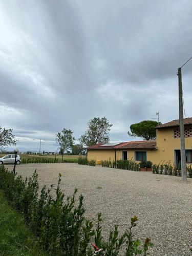 a car is parked in front of a building at La Vecchia cantina Guzzardi in Lari
