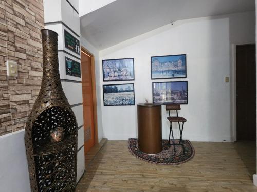 a room with a large vase on the wall at Casa Del Chen - Budget Friendly Stay - 20-30 Pax in Aringay
