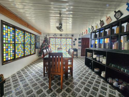 a room with a table and chairs in a room at Casa Del Chen - Budget Friendly Stay - 20-30 Pax in Aringay