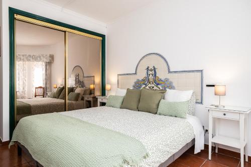 Кровать или кровати в номере Parque dos Reis Apartment 2
