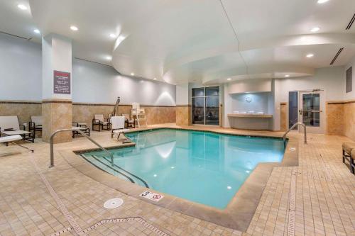 a large swimming pool in a hotel room at Cambria Hotel Rockville in Rockville