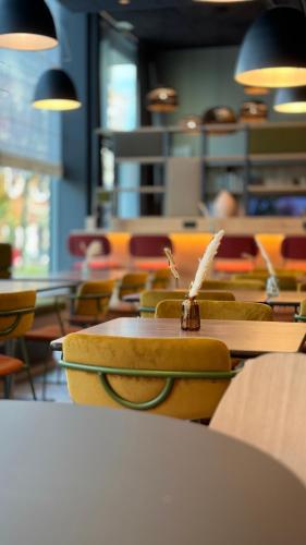 an empty classroom with chairs and tables and a book at Campanile La Roche Sur Yon Centre Gare in La Roche-sur-Yon