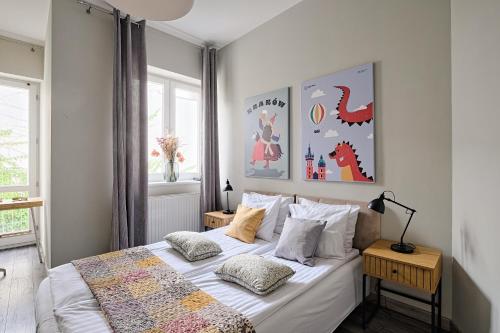 Posteľ alebo postele v izbe v ubytovaní Urban Nest Apartments Radziwiłłowska 14
