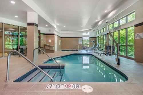 a large indoor pool in a hotel room at Cambria Hotel Madison East in Madison