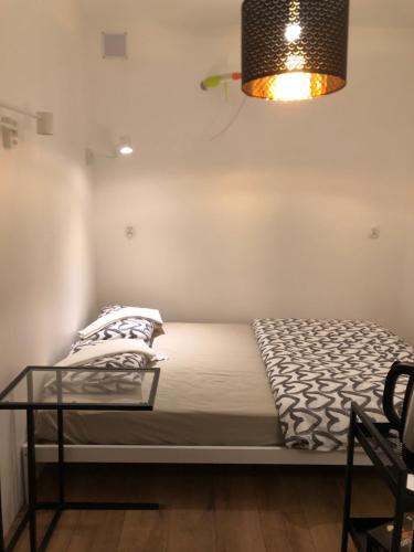 Ένα ή περισσότερα κρεβάτια σε δωμάτιο στο Mini Studio A Bed4U Late Check in