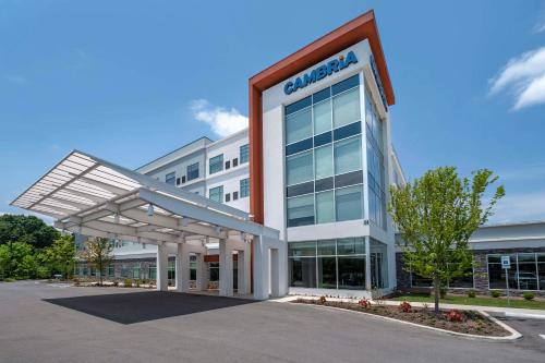 an office building with a sign for a car dealership at Cambria Hotel Nashville Airport in Nashville