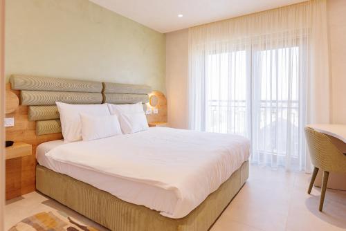 Postel nebo postele na pokoji v ubytování Hotel HOGO