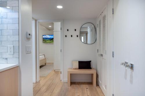 a bathroom with a sink and a mirror at Renovated 2 BR Aspen Condo Ski-in out in Aspen