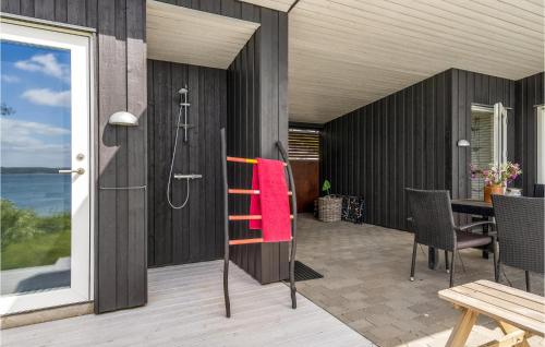 a bathroom with a shower and a red towel at 2 Bedroom Amazing Home In Aabenraa in Aabenraa