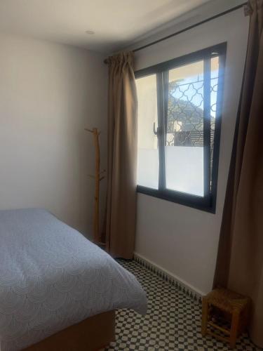 Una cama o camas en una habitación de Appartement Fatima