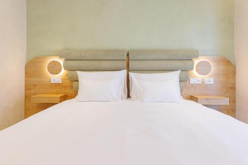 Postel nebo postele na pokoji v ubytování Hotel HOGO