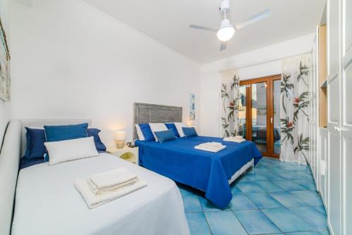 Ένα ή περισσότερα κρεβάτια σε δωμάτιο στο Costa Blue