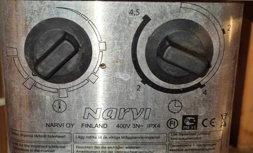 a metal appliance with two dials on it at Beautiful apartment with sauna in Tallinn