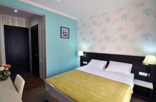 East Gate Boutique Hotelにあるベッド