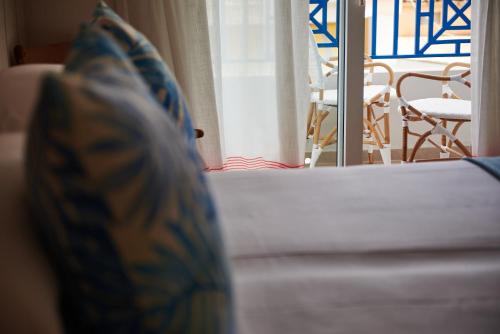 Ένα ή περισσότερα κρεβάτια σε δωμάτιο στο Hotel Honucai