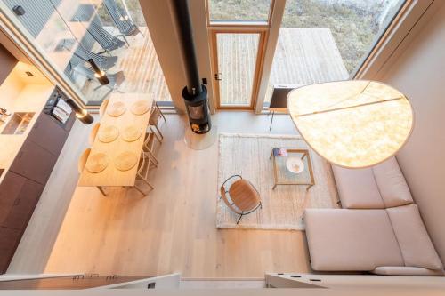 an overhead view of a living room with a couch and a table at Stay North - Joiku - Midnight Sun in Äkäslompolo