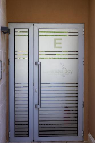 a pair of doors in a room at Morinj Lavender Bay apartment E5 in Donji Morinj